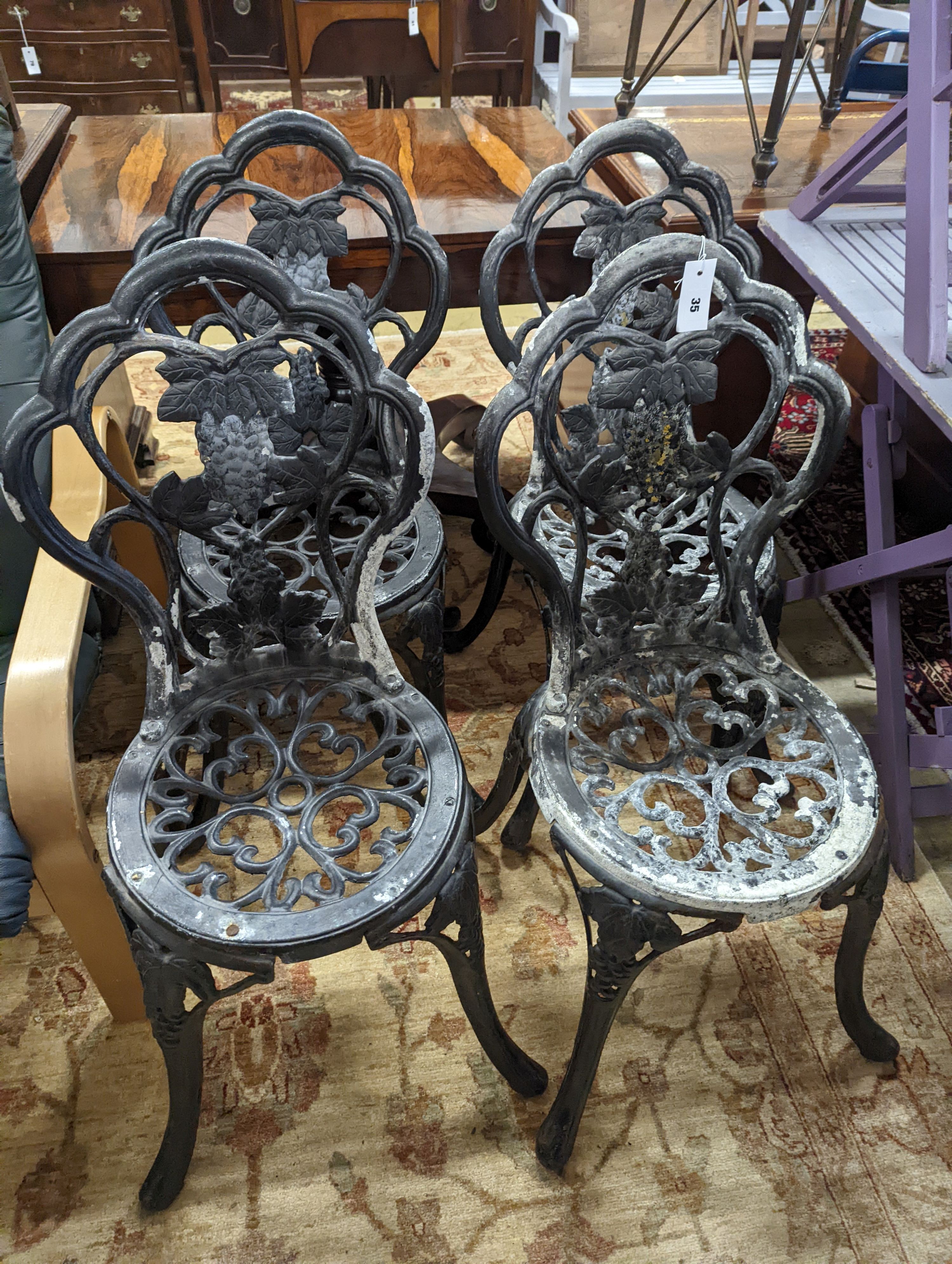 A set of four aluminium garden chairs